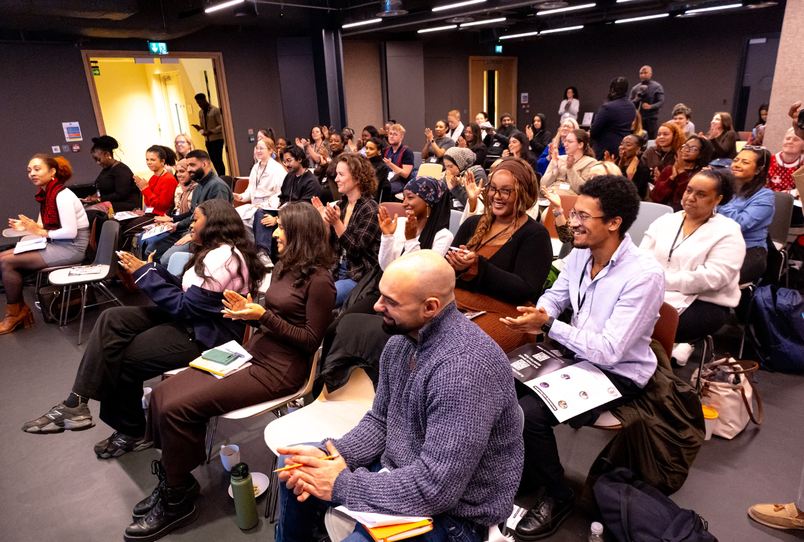 Audience applauding at a TRIUMPH gathering